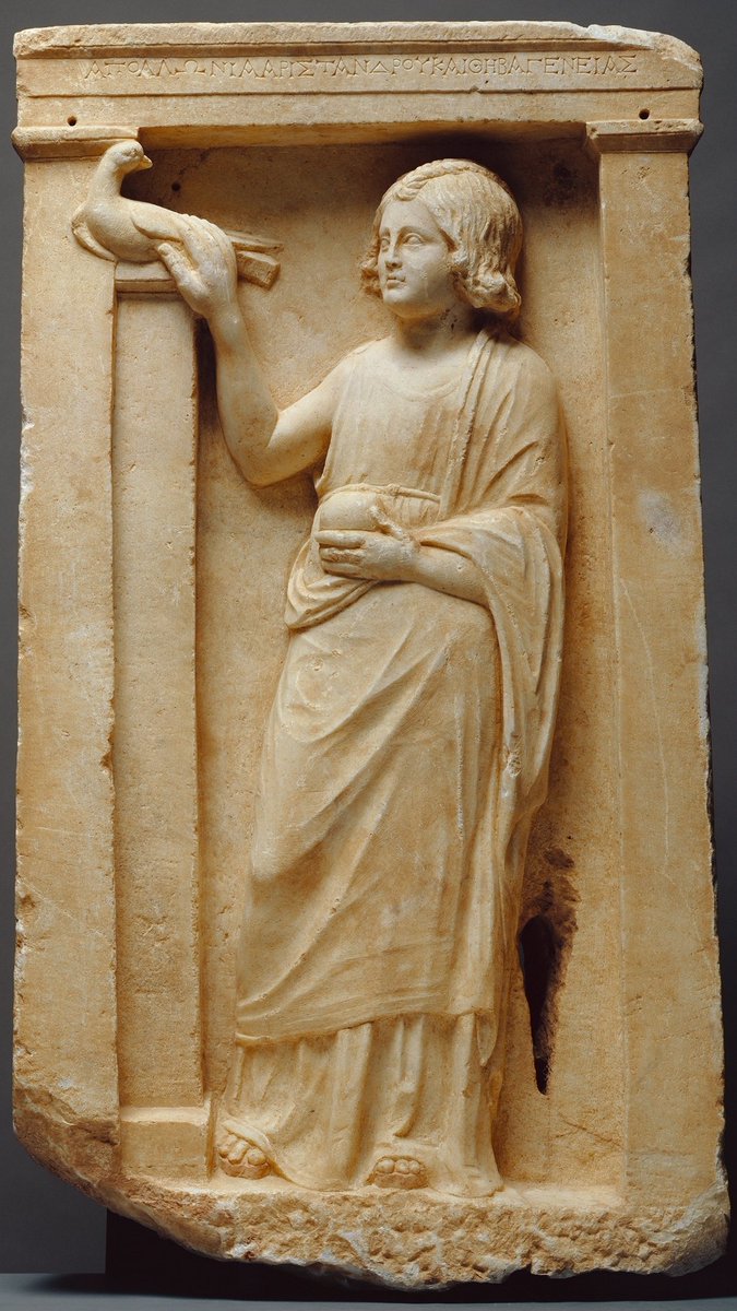 Epitaph of young girl, Apollonia. Dated 1st CE, found Piraeus, Greece. Inscribed: ΑΠΟΛΛΩΝΙΑ ΑΡΙΣΤΑΝΔΡΟΥ ΚΑΙ ΘΗΒΑΓΕΝΕΙΑΣ Apollonia, daughter of Aristandros and Thivageneia Apollonia pets a dove (symbolizing the soul) and holds pomegranate, fruit of the dead, symbolizing rebirth.