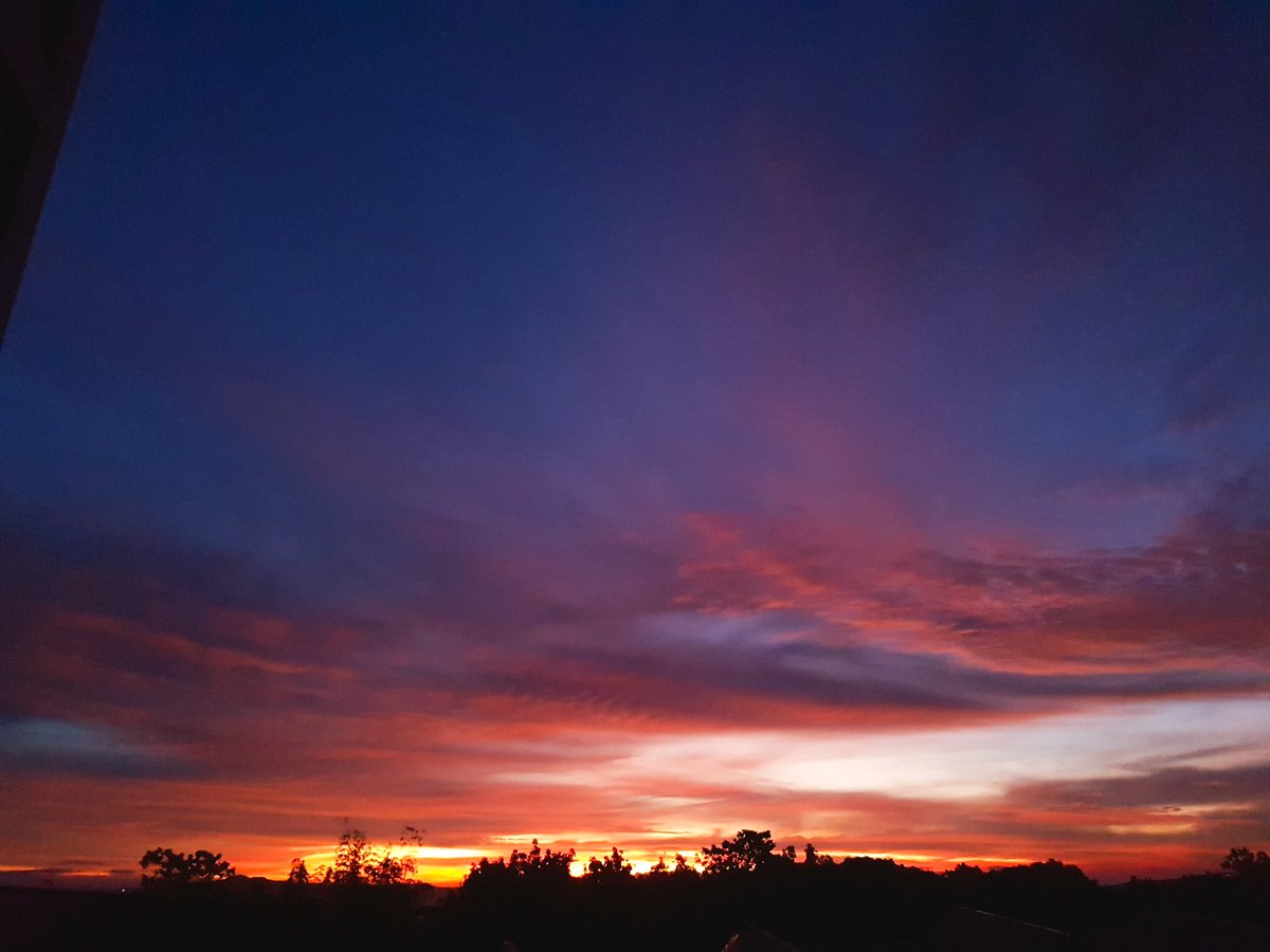 Captured this today a view from our window, I love the color of the sky, it feels like a warm hug from the back. After long hours of working, it is so great to have a view beautiful like this. #sunsetsky #sunsetview #sunsetphotography