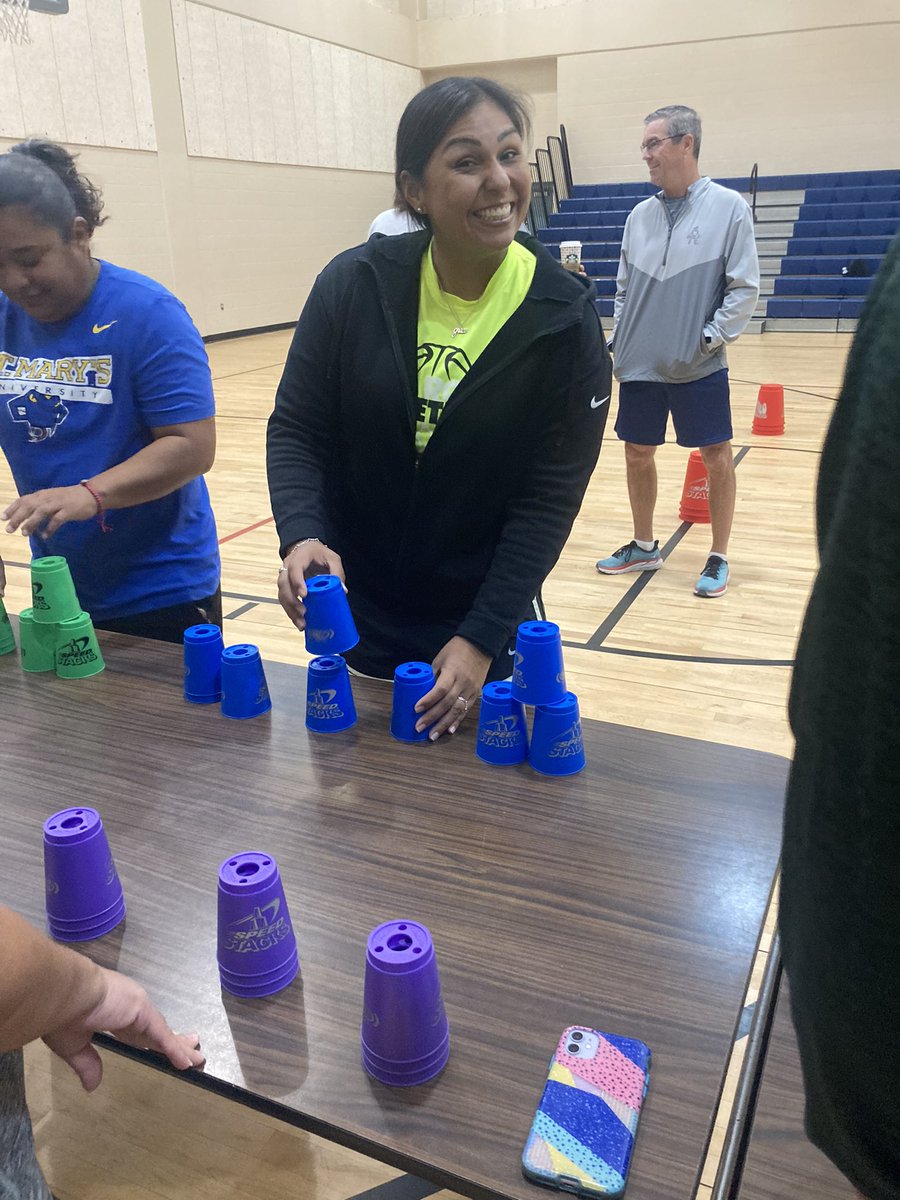 Coach Solar working with our  cupstacking module at our staff development! #PEisFun    @RebeccaSolar @NISDRoss