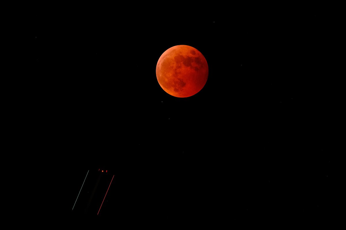 Jonathan_Webb_'s tweet photo. It’s not a fighter jet… but something got in my picture of tonight’s lunar eclipse over Tokyo! https://t.co/bOYYKjPvyv