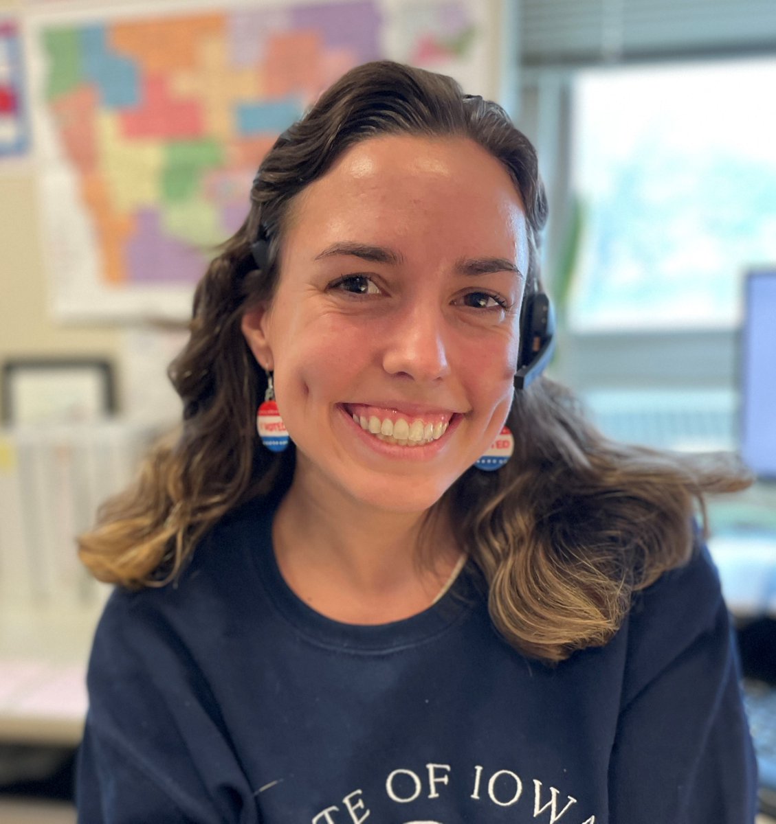 IowaSOS's tweet photo. “Election Day is my favorite holiday!” Kathryn Hays is sporting her festive “I Voted” earrings today and answering calls to help Iowans vote! #BeAVoter https://t.co/6iaQ9FFm4V