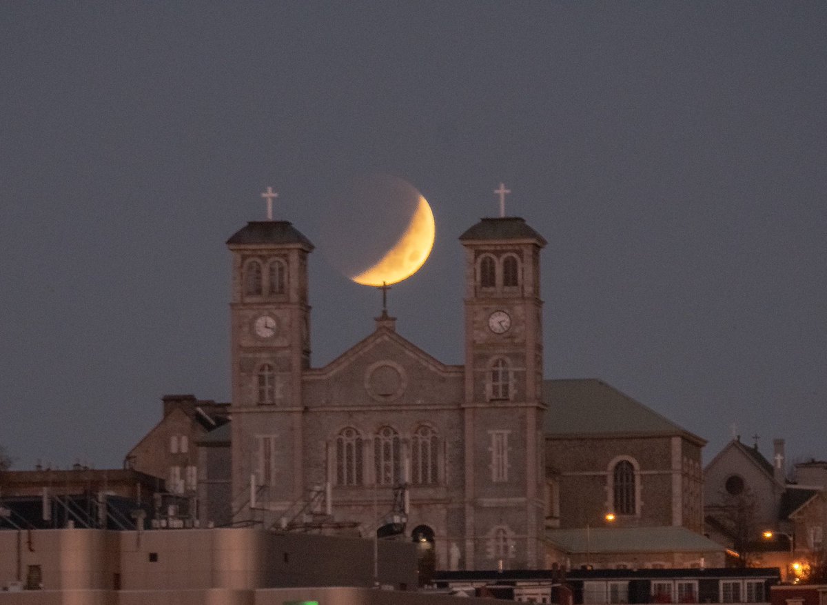 Moon in eclipse passing behind the Basilica. #nlwx