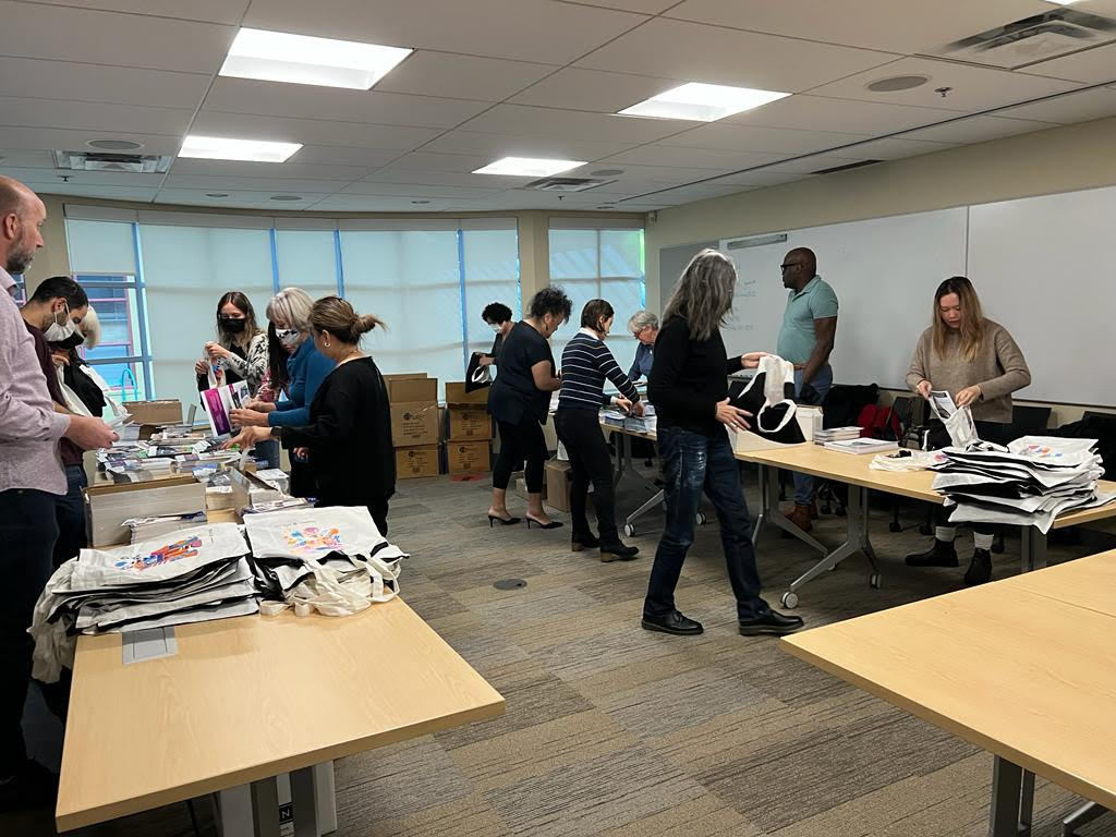 BCNPHA's tweet photo. Preparation for the 2022 #HousingCentral Conference is well underway! It takes teamwork to stuff all of the delegate tote bags we'll be handing out. https://t.co/ltp4hvFVsX