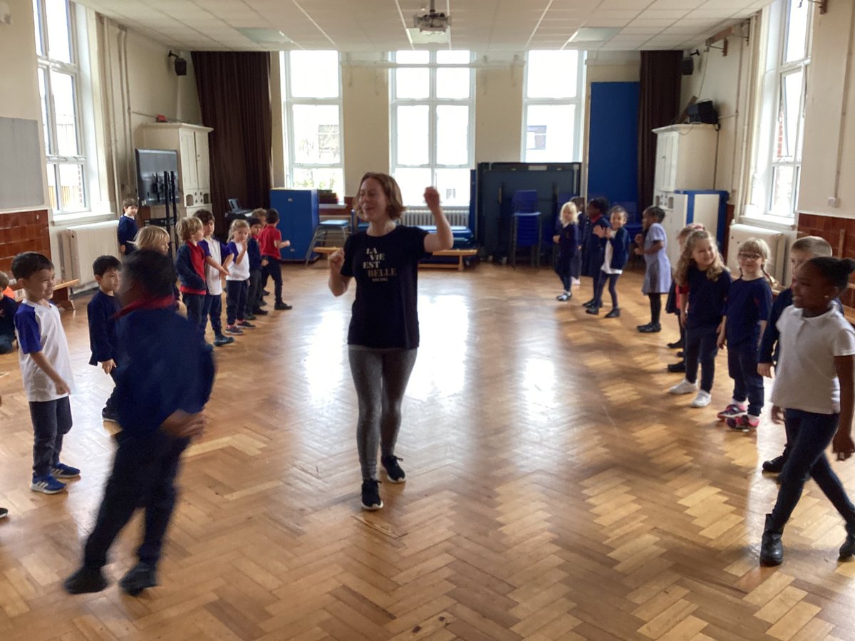 Year 1 enjoying their dance lesson focusing on travelling to music using rhythm.