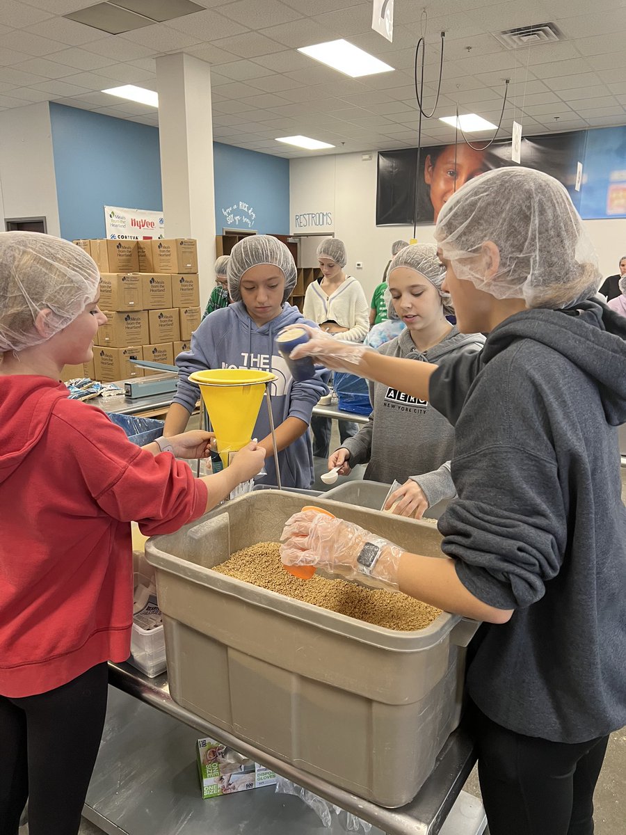WG Hawks are Impactful! Our 8th grade is volunteering at Meals From The Heartland to help make and pack meals. It was a great opportunity to give back! #WGBuildingFutures