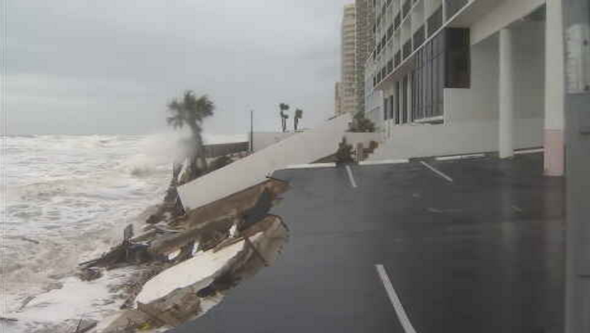 RustyMcCranie's tweet photo. Daytona Beach Shores. First image at 6:30am. Second image 7:45am. Concrete wall and parking spaces crumbling as wave action pummels the coast at high tide this morning. And onshore winds will continue the next 48 hours. Coast left vulnerable after Ian. https://t.co/a7cOQLLn2H