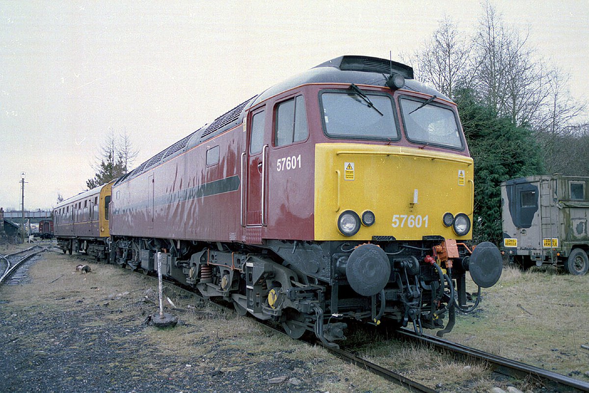 West Coast Railways Class 57 57601 wearing the first WCR livery stands with the company's saloon at the Carnforth base on 26th March 2004

#Class57 #BrushType4 #GeneralMotors #Ronnie #Bodysnatcher #WestCoastRailways #Carnforth