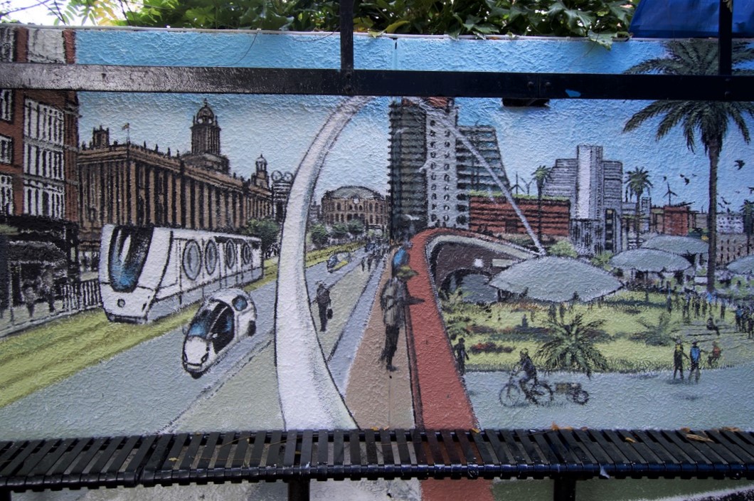 UniversityLeeds's tweet image. 🚊 A tram, electric cars and cycle-rickshaws

🌴 A riverside eco-park

🌍 A 'citizens assembly' where local issues are debated with a view to adapting and mitigating climate change

🕶️  Solar sunshades cooling the area (the fabric of the sunshades generates power)