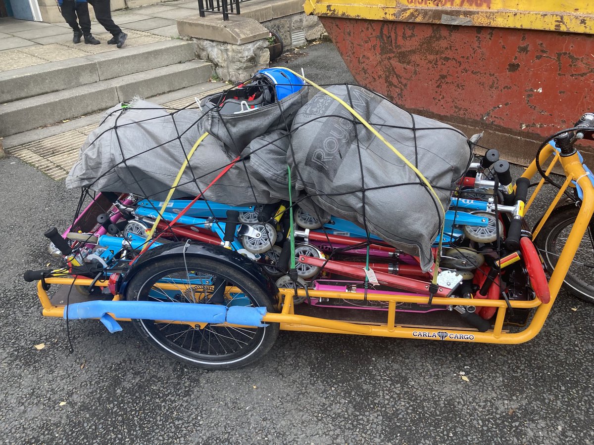 A heavily loaded ⁦<a href="/carlacargo/">CARLA CARGO</a>⁩ trailer. Transporting 30 scooters and helmets to ⁦<a href="/whatsonatcampie/">Campie Primary</a>⁩ by cargo bike. #ibike #activetravel