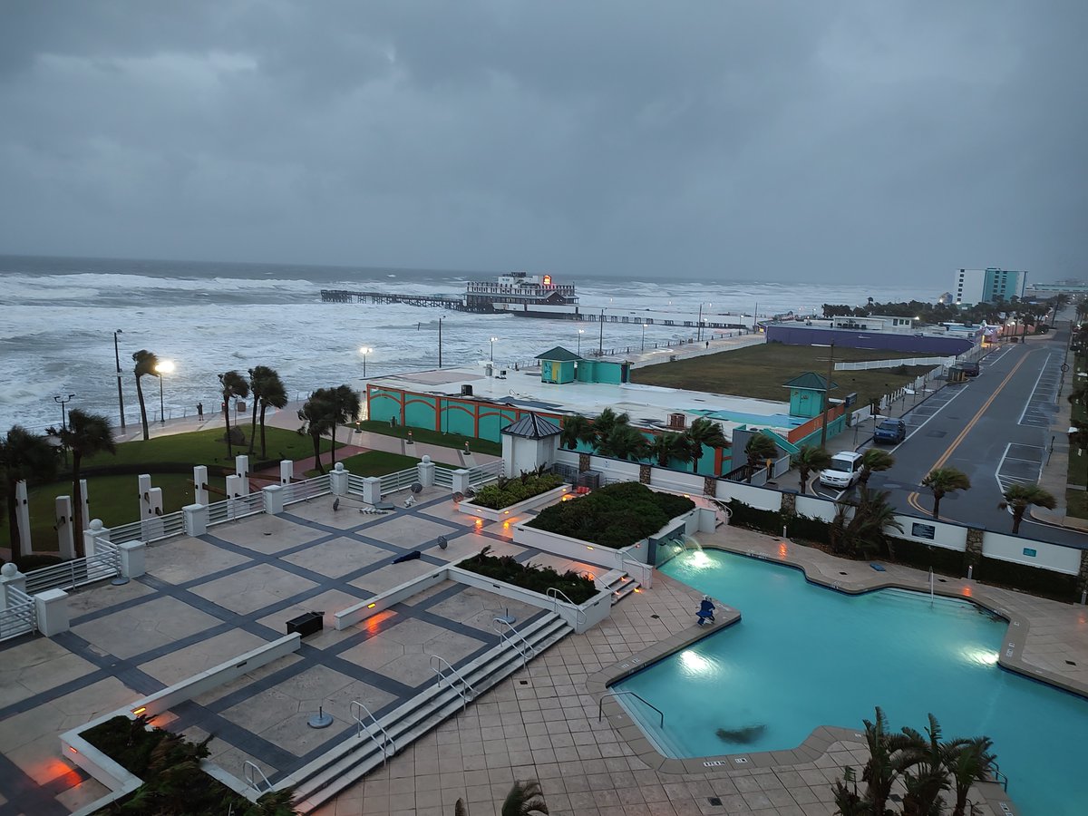 WESH's tweet photo. A frightening sight in Daytona Beach...shore already gone, just waves hitting against the seawall.

📸: Angel Morales https://t.co/ma8114eW7h