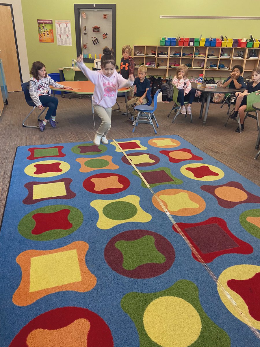 MrsMulligan_AOE's tweet photo. Today the students had a chance to learn about the Olympic long jump. We measured how far each student could jump. After we practiced using the number lines with making hops of 10, 5, and 1. #aoes #mathisfun https://t.co/Z7WgRGkiaB