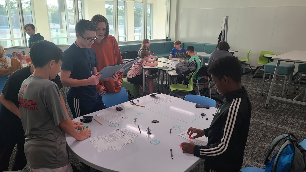 ElmerKMS's tweet photo. DND club enjoyed having dice, character binders, and figurines! Our dungeon masters are running great tables for everyone. #kmscougarpride #dnd #dndclub #KMSdnd https://t.co/PyvgRKIN2h
