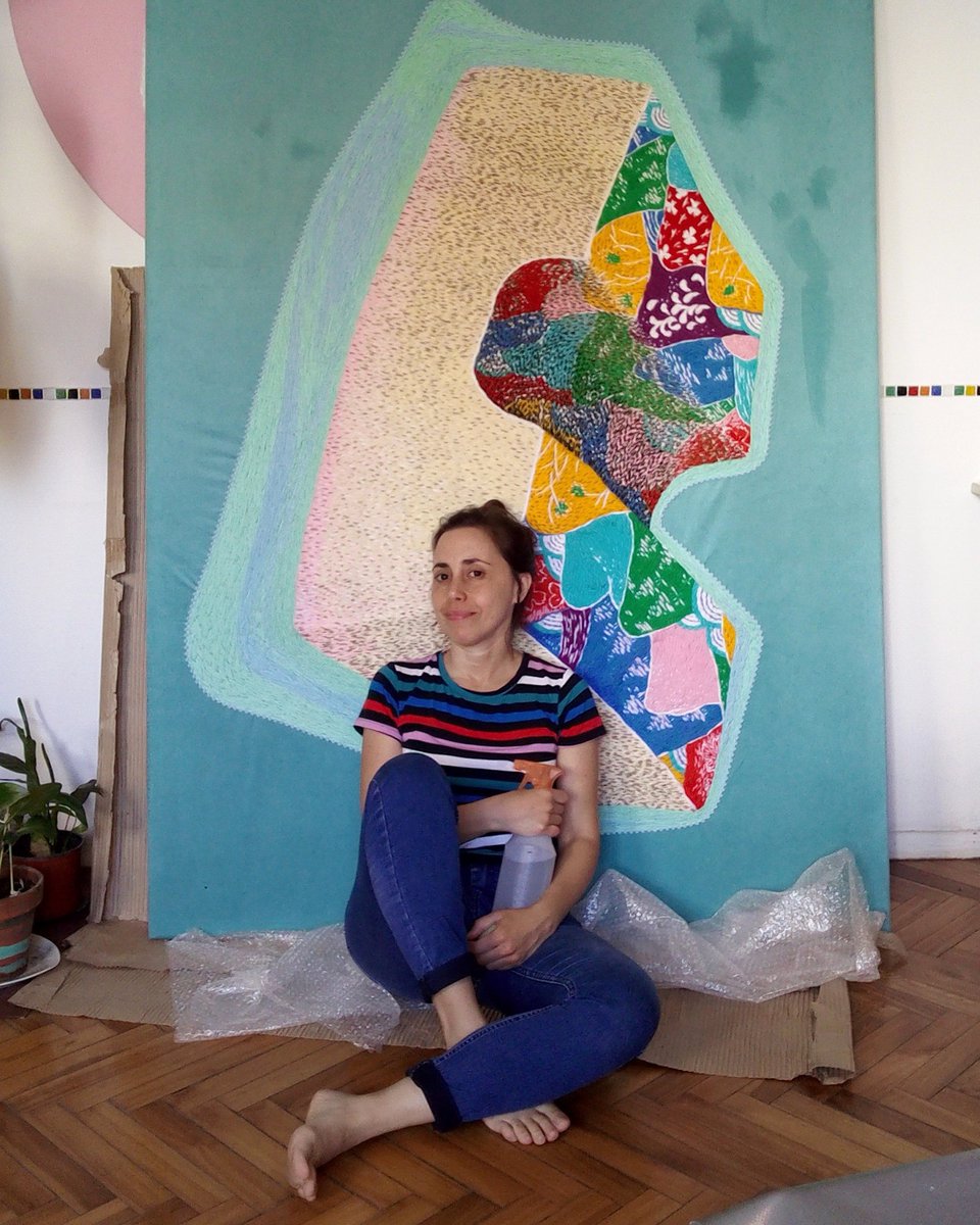 My face doesn't express it but in the photo I am very happy preparing this embroidery called El Badén for an important visual arts salon in Argentina where it was selected.