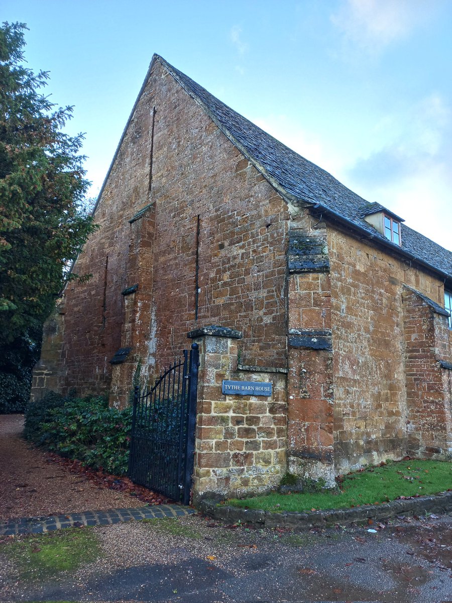 Towler's tweet image. Due to an unplanned meeting of car with central reservation barrier, smaller roads felt more appropriate. With small roads come glimpses, and glimpses mean stopping. In this case next to Adderbury #tithebarn built in 1422 for New College, Oxford.