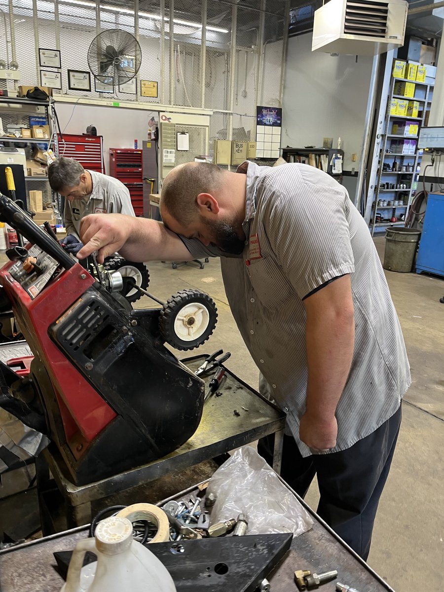 Travis Warren, a bus mechanic in our bus garage, takes a moment to ponder a snowy winter sweeping thru Missouri as he services our pequeno toro snowblower!
