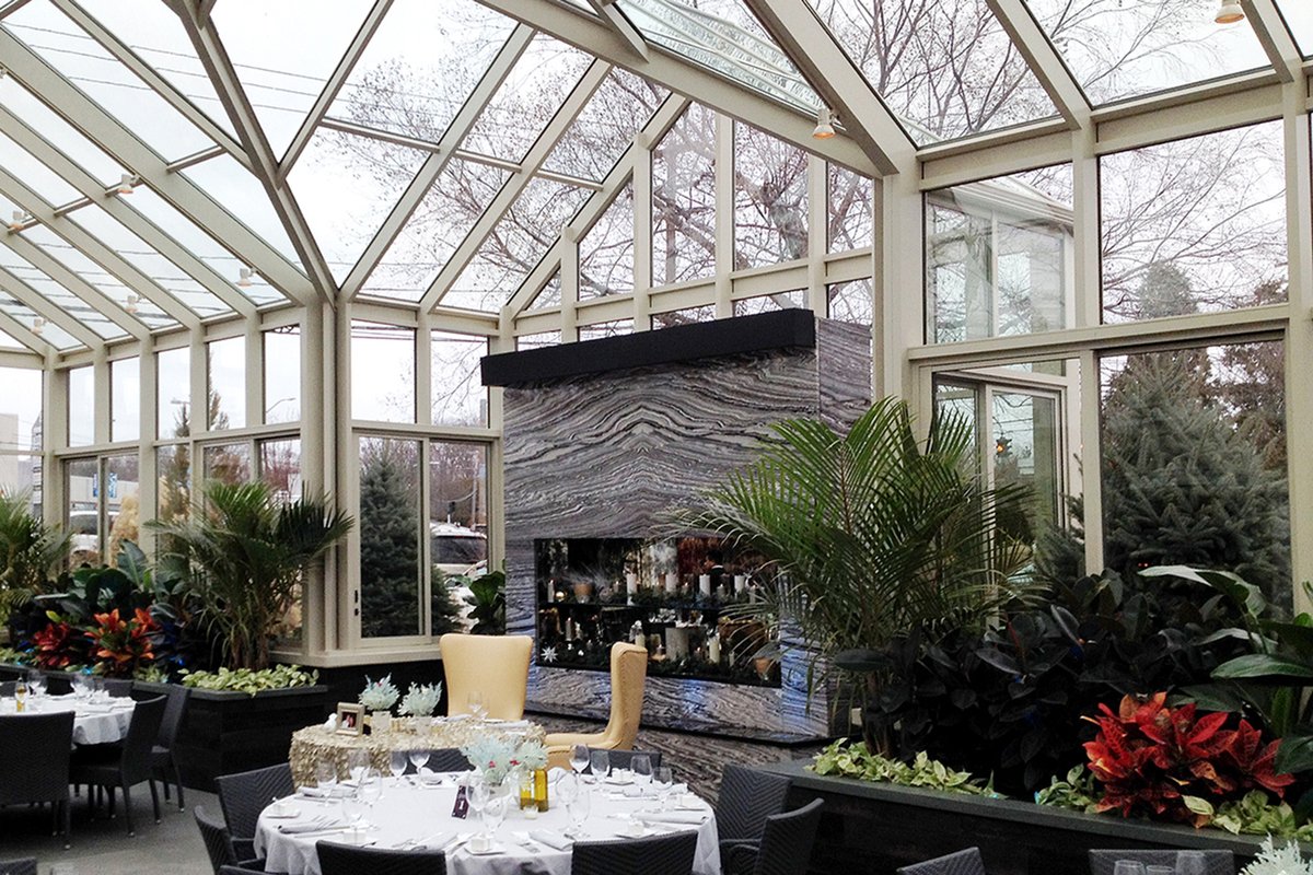 DINING UNDER THE STARS. Measuring 51 ft. x 28 ft., this straight-eave, double-pitch glass structure houses a complete dining room connected to the main restaurant. Contact a sales representative to learn more.