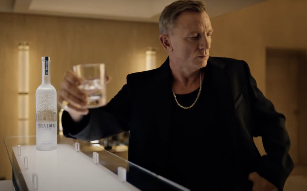 IndieWire's tweet photo. Former James Bond star Daniel Craig plays “himself” in a new commercial for Belvedere Vodka, directed by Academy Award winner Taika Waititi. Watch here: https://t.co/NYyrAvYra4 https://t.co/Qp91N0LCNu