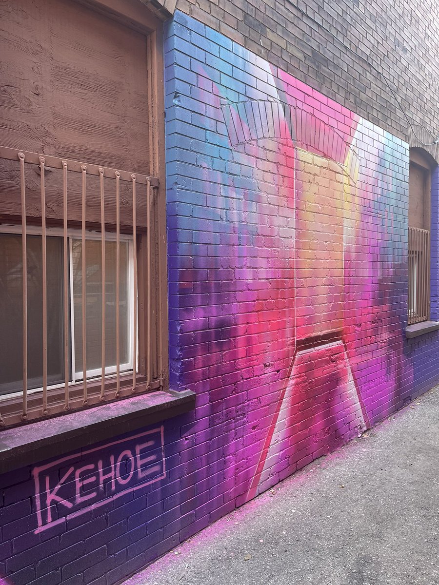 Met Victoria today - one of the artists responsible for #cbridge’s  newest murals in an alleyway. She is sitting on the piece entitled “Take a Seat”.  Guess where this is?  You’ll be amazed. #murals therecord.com/local-cambridg…