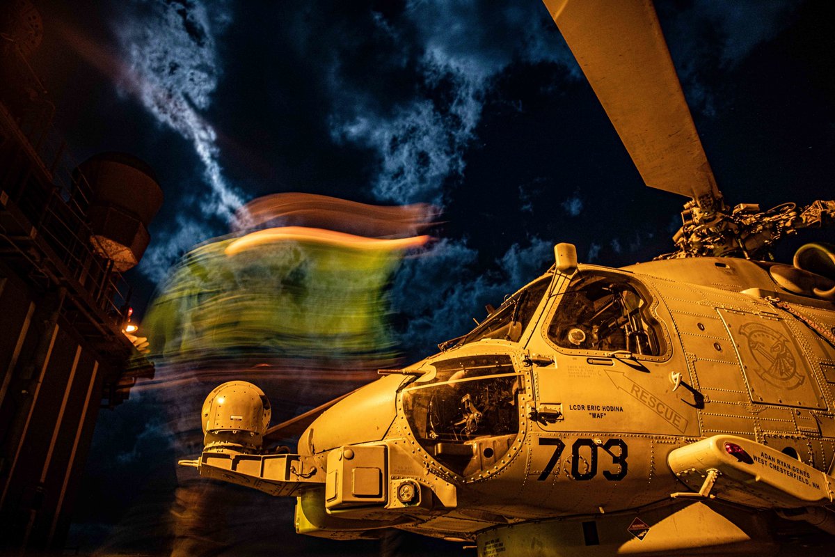 Awesome Fleet photo!! Sailors conduct night inspections on a MH-60R Sea Hawk helicopter assigned to the “Saberhawks” of Helicopter Maritime Strike Squadron (HSM-77) on the USS Chancellorsville (CG 62) in the Philippine Sea. ⚓#USNavy #HOOYAH