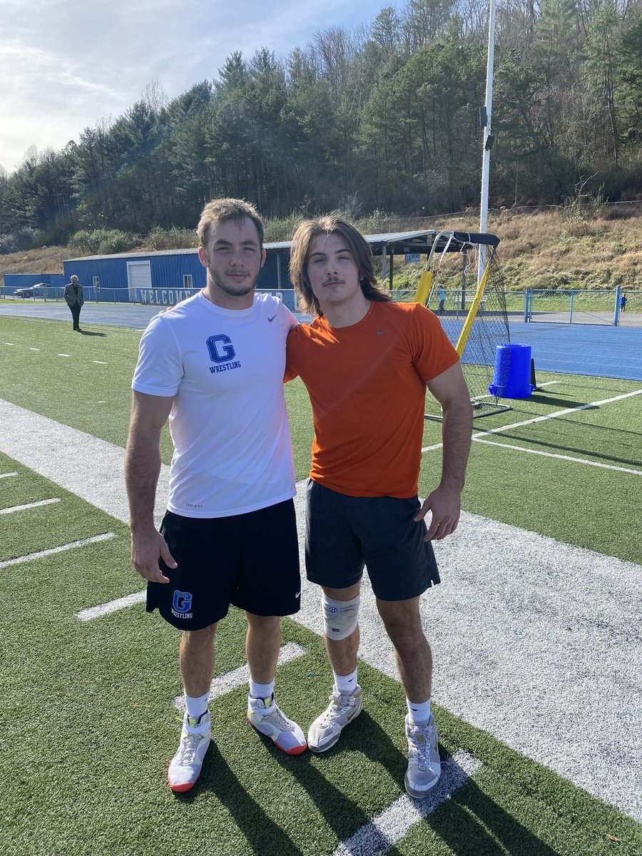 BLHS_Takedown's tweet photo. Former Raider Wrestlers Cole Houser (Glenville State University) and Steele Boysel (Findlay University).  Glenville hosted a quad meet on their football field today.  It’s great to see two former teammates make time for each other!  #RaiderBrotherhood https://t.co/B6ScxEAlpd