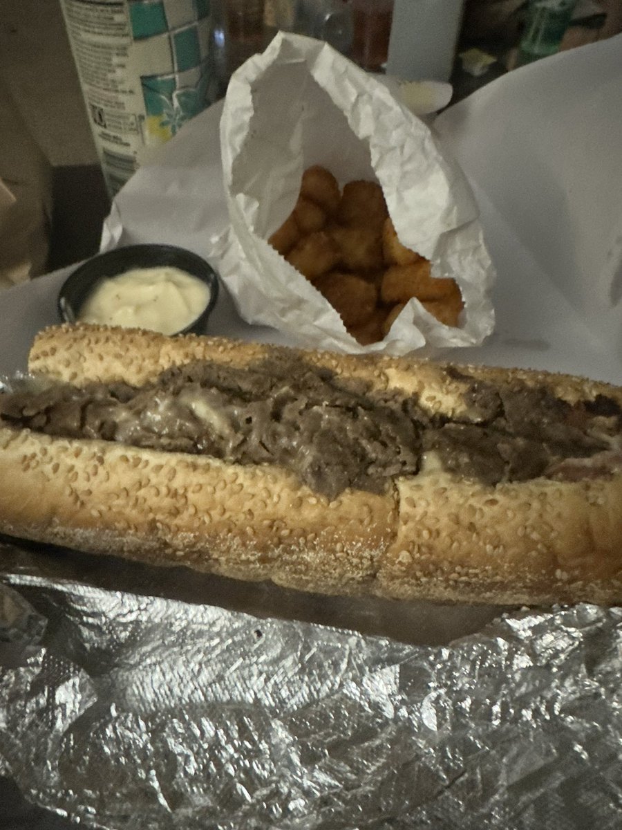 docjager22's tweet photo. When someone asks what I want for my last meal, it’s this…Trenton cheesesteak(pork roll and Cooper sharp cheese) old bay tots with American cheese sauce, and an Arizona iced tea #johnnylonghots https://t.co/lEYFChlWoG