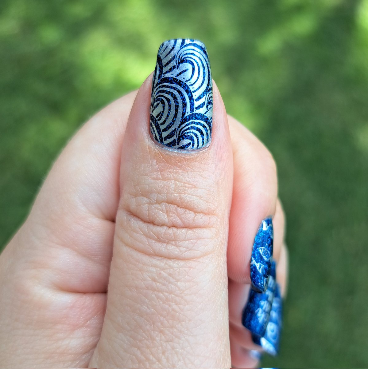 This week's polish: rocking Diamond Rain from @StarrilyInc (in collaboration with the lovely @kelli_marissa), paired with Stamped Silver from #PicturePolish, and stamping plates 07 & 20 from @MoYouLondon's Sailor Collection. 💙💅✨️🌊 #nailstamping #starrily #moyoulondon