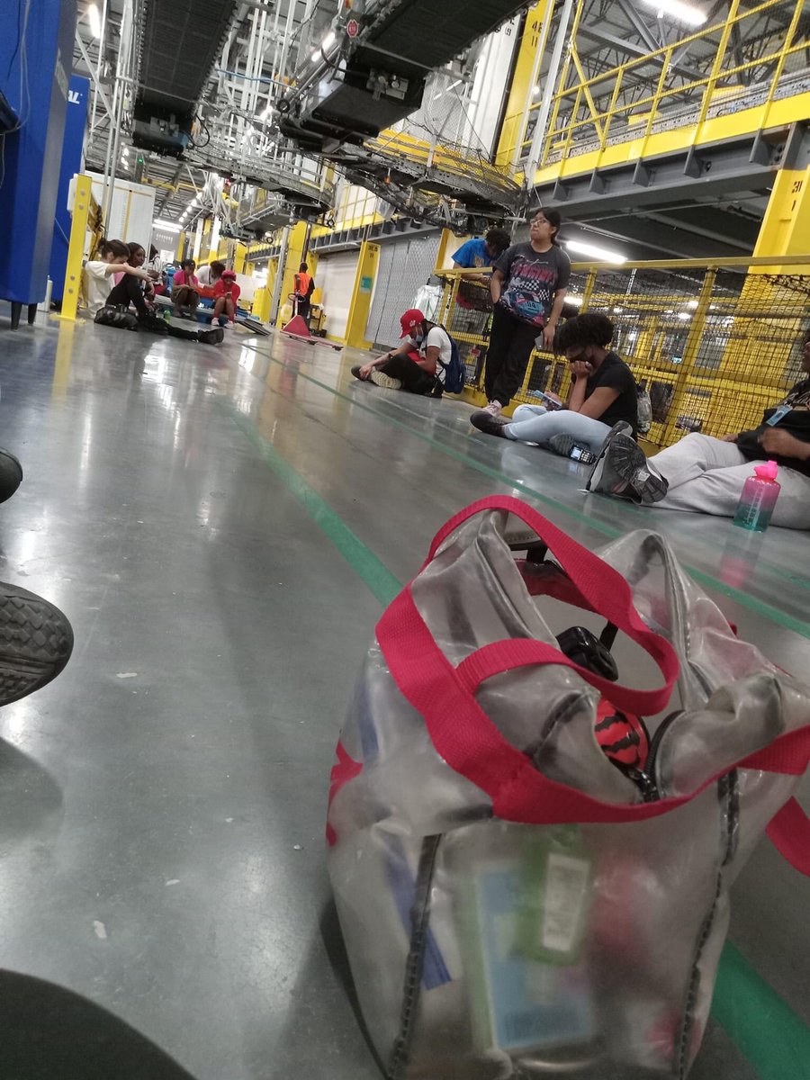 The side of Peak Scamazon doesn’t want you to see workers so tired they literally just sit on the green mile  because there’s no point in walking to cafeteria for a 15 min break 👎 #ShameonScamazon