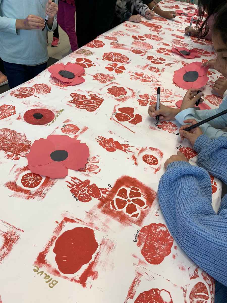 Adding our poppies to our whole school Remembrance Day art piece <a href="/DesmondHDSB/">Viola Desmond Public School</a>