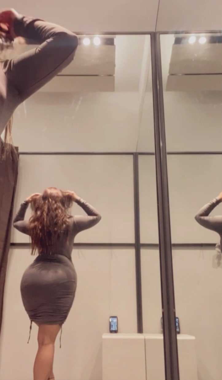 She flashes a playful grin