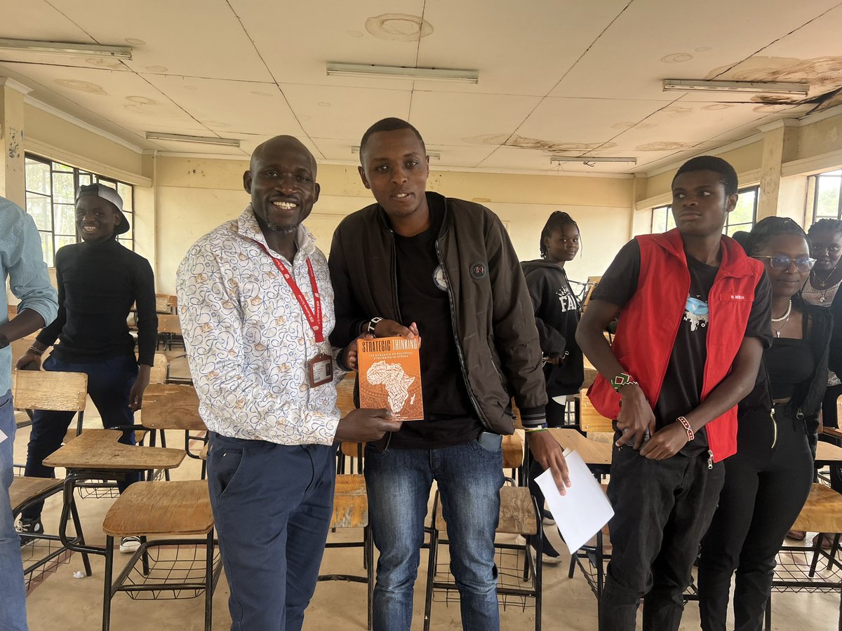 OgolaFogola's tweet photo. Toured @mmumalaysia giving motivational speech to comrades. @qalii__ receiving a copy of my book for free for being most attentive student https://t.co/koNq3I9eux