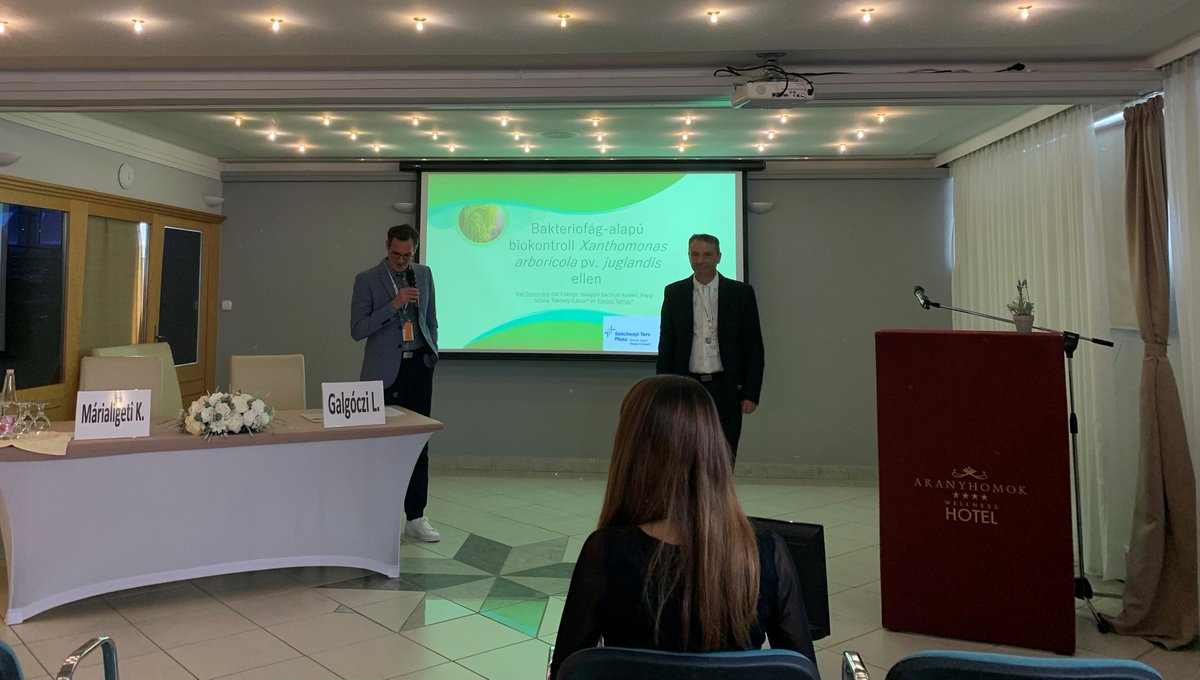 PhageFireEu's tweet photo. Deputy CEO Dr. Tamás Kovács of Enviroinvest and Ph.D. student Dominika Bali gave a presentation on the R&amp;D of phage-based biopesticides at the annual meeting of the Hungarian Society for Microbiology. Results of the Phagefire project were also presented during the presentation. https://t.co/IUHH8BoT2S