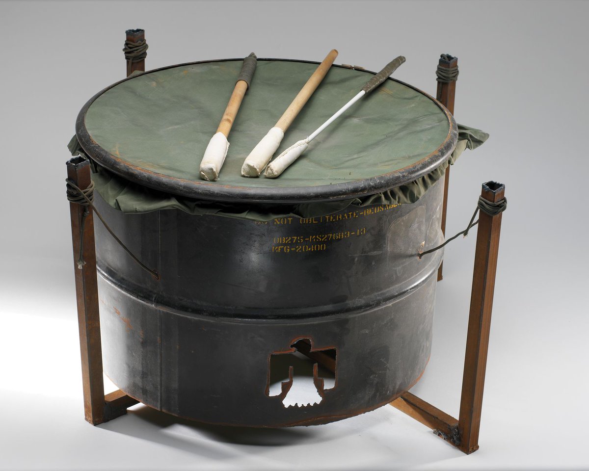 smithsonian's tweet photo. This powwow drum—made from a discarded 55-gallon oil barrel and canvas from a cot—was used in a 2004 powwow organized by Sergeant Debra Mooney (Choctaw) and the 120th Engineer Combat Battalion in Iraq. Titled "Desert Thunder," it's now in @SmithsonianNMAI. https://t.co/P3gUe3du15
