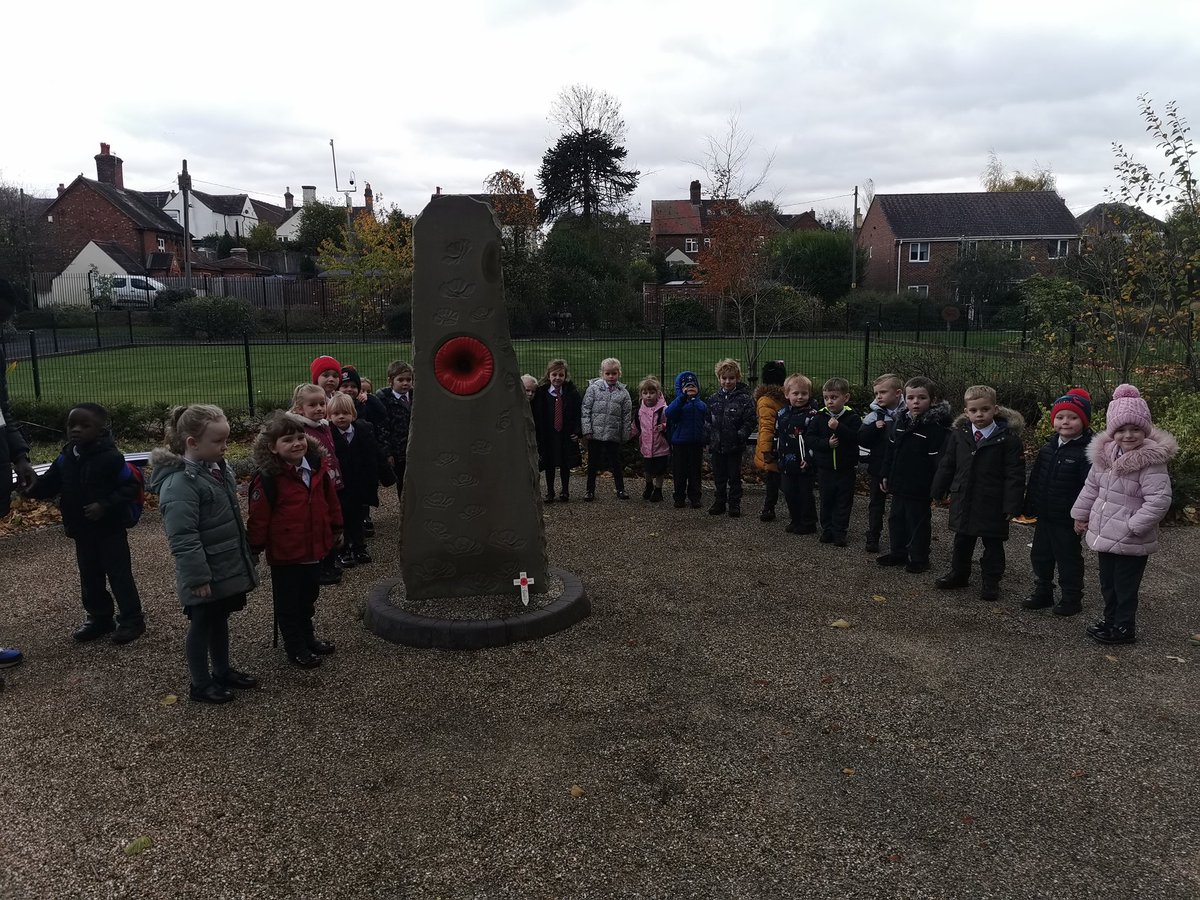 Reception class paying respect at the war memorial
