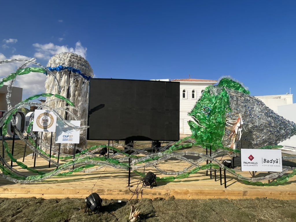 Raffa_Piz's tweet photo. A visit to the #GreenZone 🟢 at #COP27 

“The compressed plastic waste blocks symbolise humans' construction of buildings that is replacing nature and its animals”

#TowardsZeroWaste #ZeroPlasticPollution 🚫
#UCCatCOP27 
@eriucc @UCC @REWATERGY_EID https://t.co/nsyC8zMB8i
