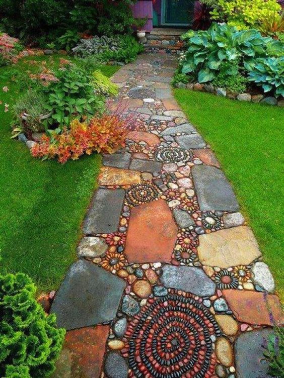ElliottBlackwe3's tweet image. How wonderful that there are those who think even a sidewalk to one's house should be a thing of beauty. I would love to have such a path in my garden.