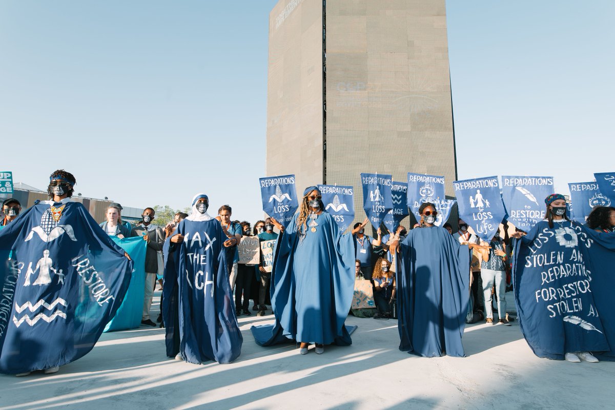 Greenpeace's tweet photo. 🌊 After a year of unprecedented climate impacts across the world, women from Global South are bringing the flood from their homeland to #COP27 to remind polluters that climate damage is done and #ClimateJustice must be served  ⚖️  #FloodTheCOP27

📸: Bianka Csenki https://t.co/sVV8pHNej9