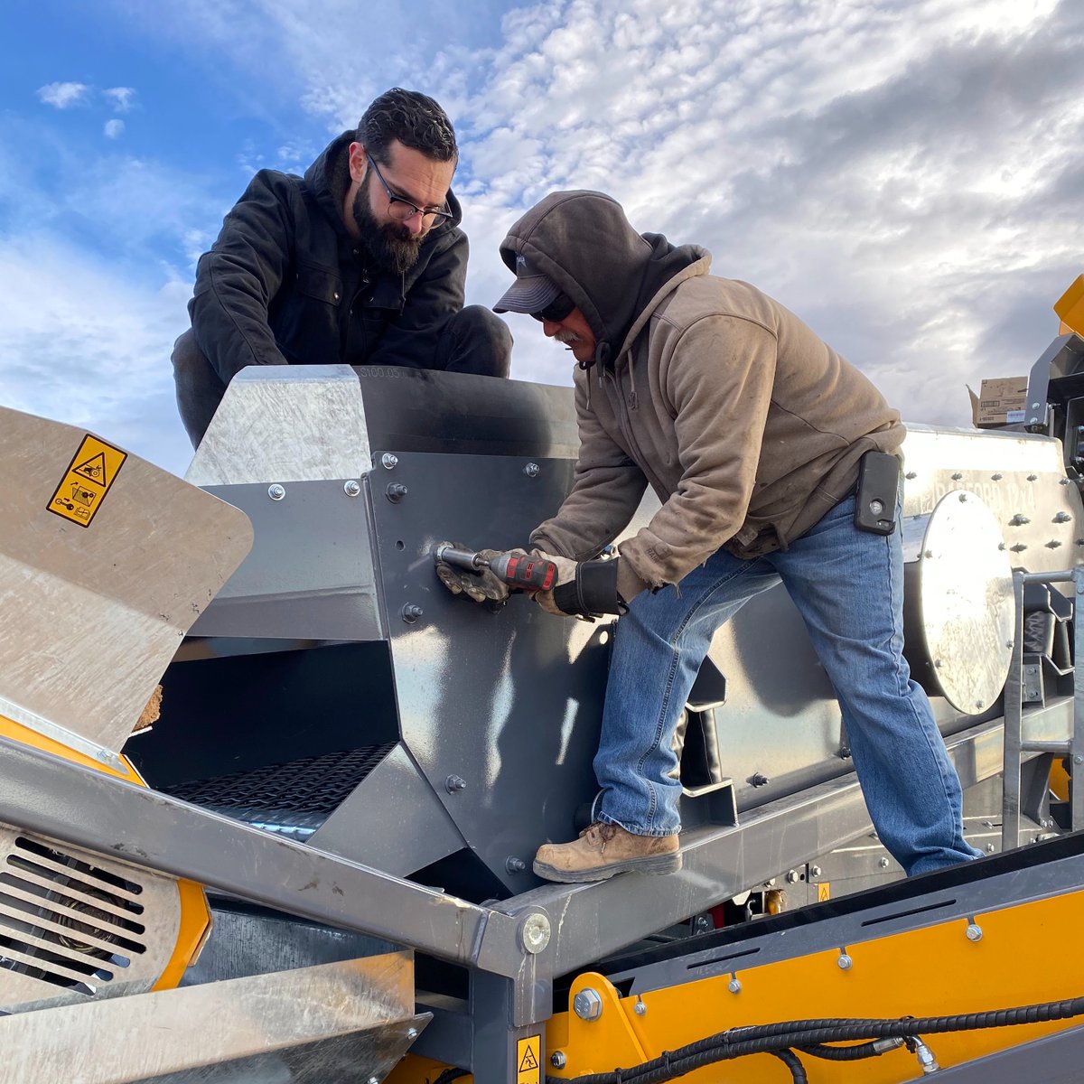 Our CEO Clem [black jacket] helping out with setup at our latest delivery. 
“We're building a product that customers love. To understand how we can improve their experience, we get out onsite with them to help with setup and spend the day training the team on their new equipment"