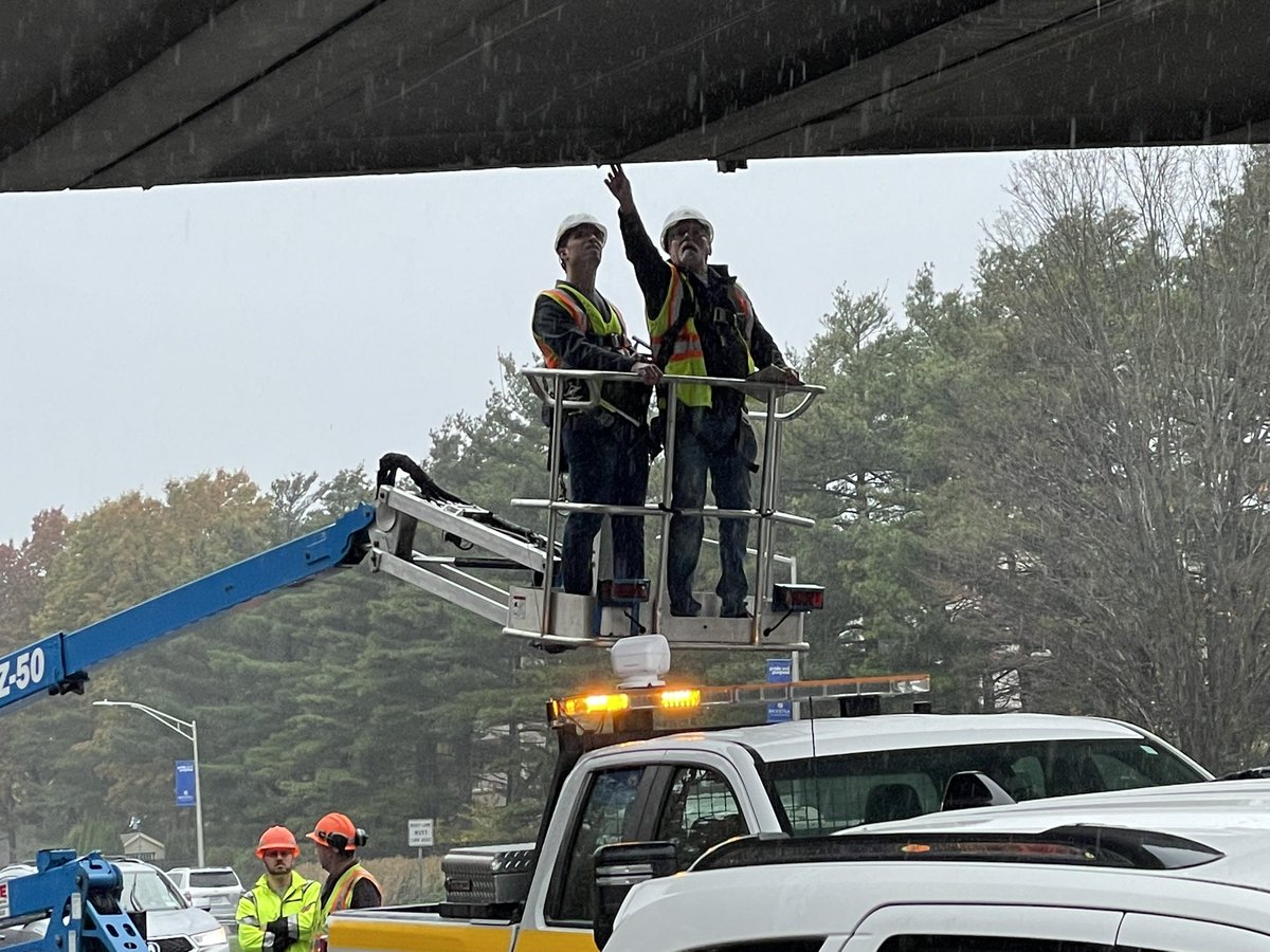 Engineers from NY State, the town of Hempstead and Hofstra Univ.  inspect the unispan walkway across Hempstead Tpk after a truck it the structure yesterday afternoon. Officials say the walkway will remain closed at least for the next few weeks while repairs are made.  #hofstra