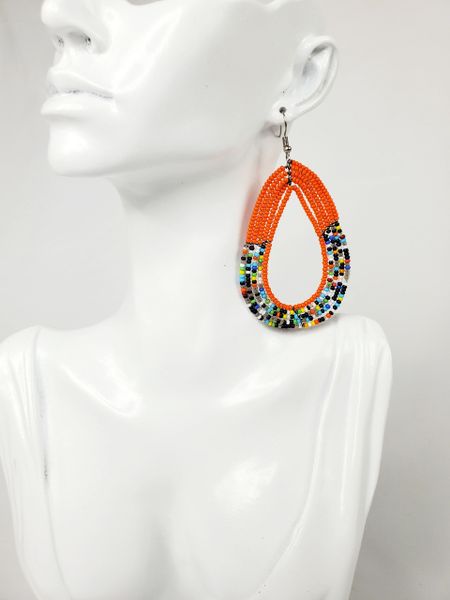 Nairobi Dark Orange Beaded Dangling Earrings with Multiple Beads.

Dark orange beaded dangling earrings with multi color beads. Classy and stylishly handmade in Kenya. Crafted elegantly for special occasions.
Sale price: C$30.00
