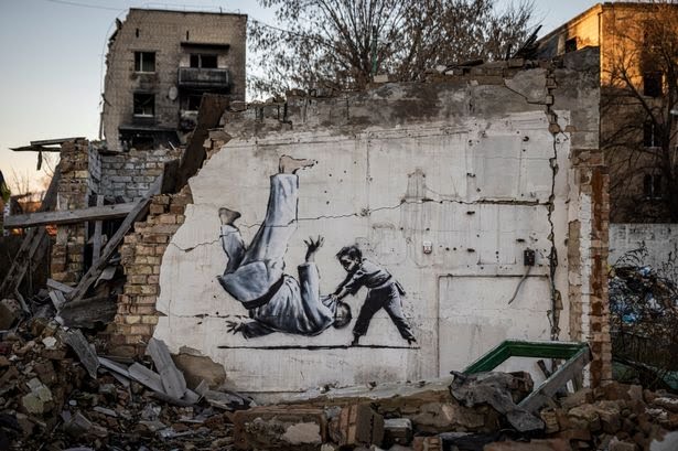 A suspected Banksy in Borodyanka, Ukraine of a child throwing a man on the floor in judo clothing 

Image: Ed Ram/Getty Images