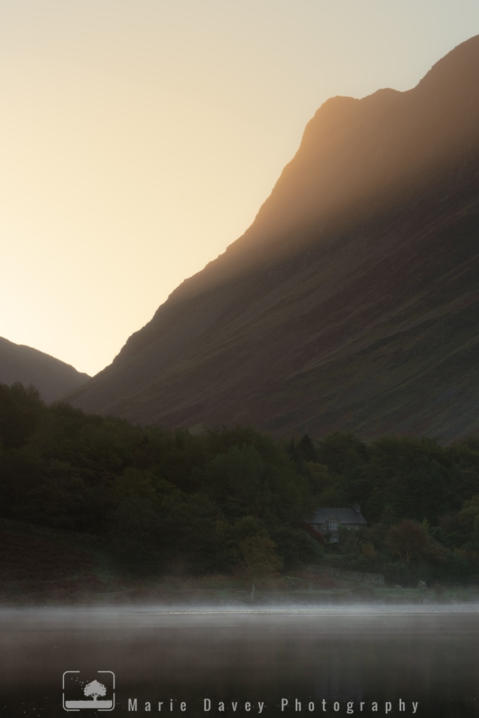 A slice of subtle perfection from the Lake District... (a shot that needs to be seen big to appreciate it fully). 

I loved the shaft of light before the sun appeared, the house nestled on the shores of Buttermere &amp; the mist floating on the water - a magical moment 

#buttermere