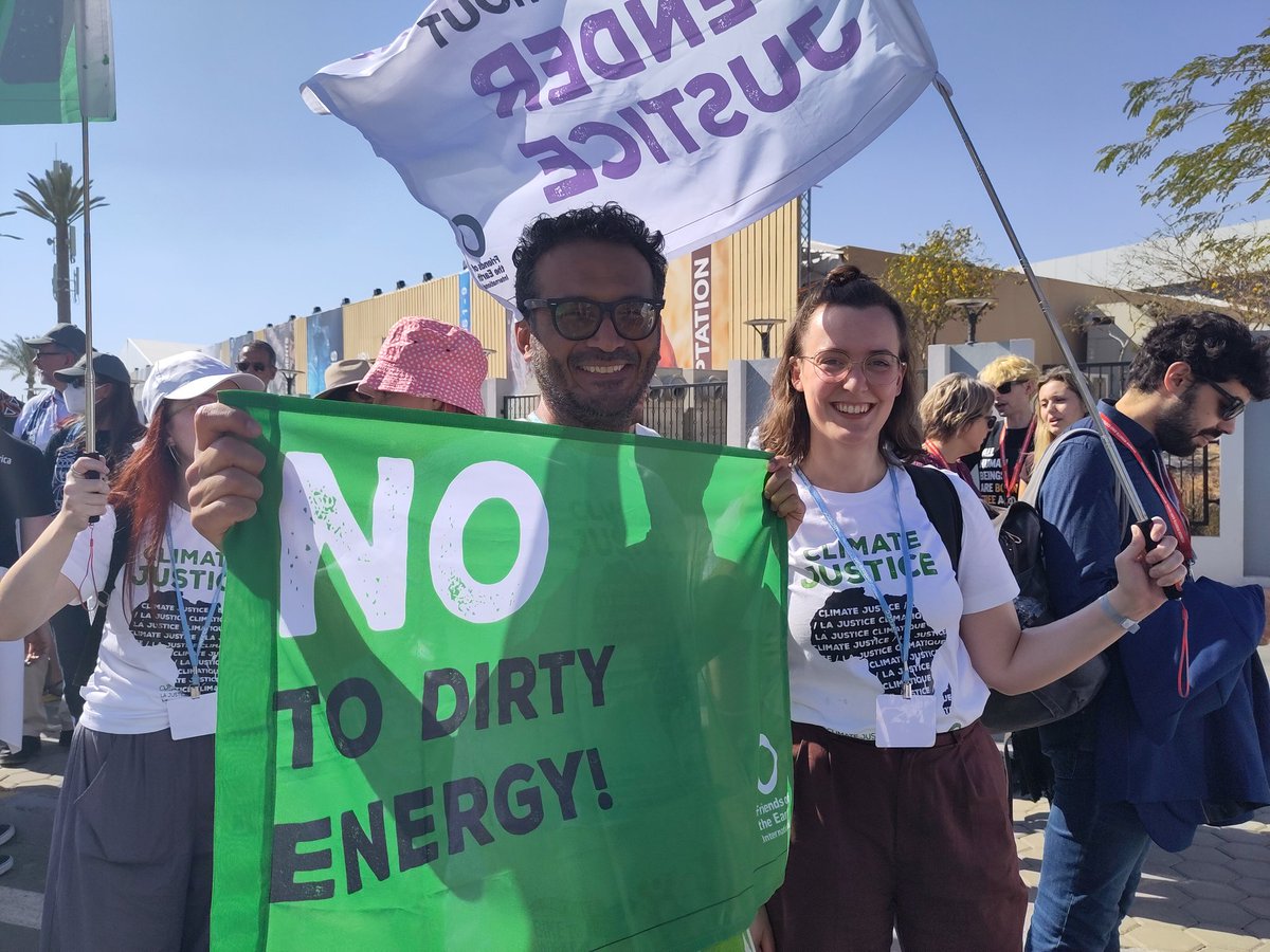 FoEint's tweet photo. Marching for #climatejustice #systemchange and #humanrights at #COP27 as part of the #GlobalDayofAction. No climate justice without human rights! #WeAreNotYetDefeated https://t.co/BdwGycNyl3