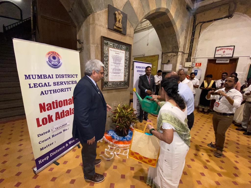 Inauguration of National Lokadalat by watering of plants by Litigants in presence of Honble Chairman , DLSA , Mumbai Shri. Anil Subramaniam.