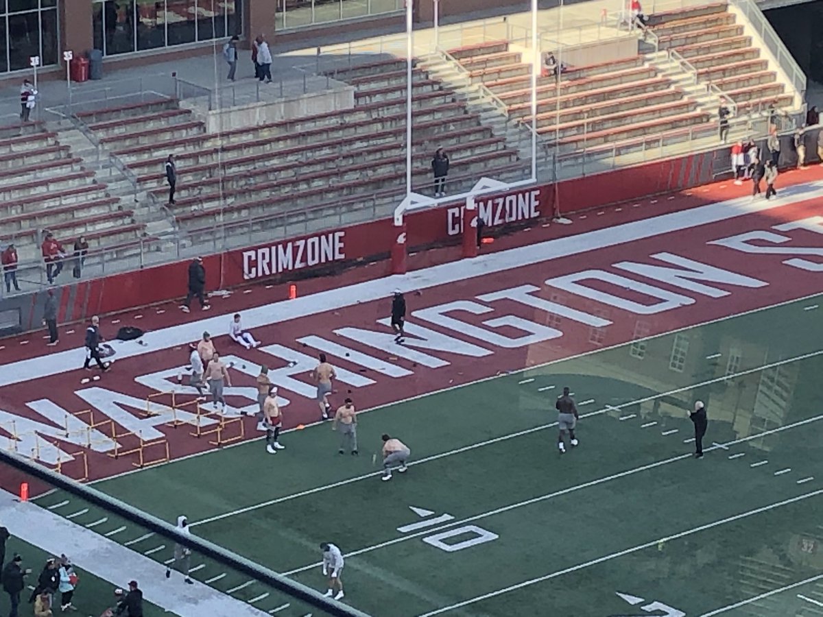 The offensive line and one of the coaches are out warming up shirtless. #GoCougs #Wazzu