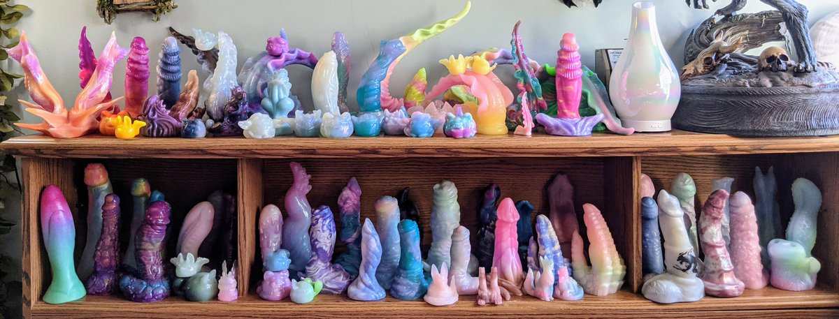kimber_andrea's tweet photo. I know I just uploaded this old headboard collection pic from early 2021 last week, but I took a new headboard pic for comparison! I couldn't fit every toy on the headboard, so I left out all of my BD toys plus a couple dark stragglers (totaling 14 toys that didn't make the pic) https://t.co/z63Z7gPGej