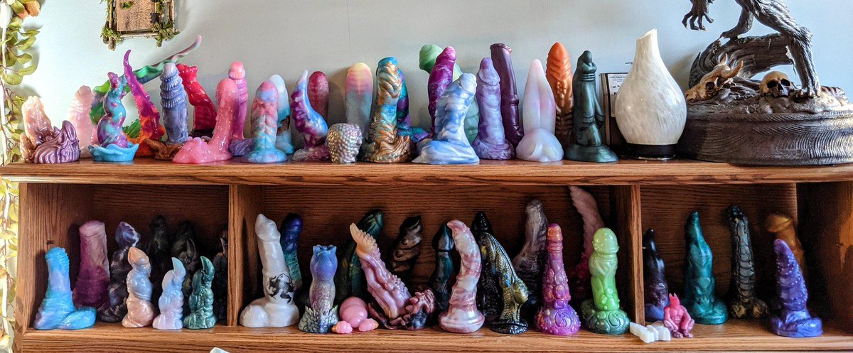kimber_andrea's tweet photo. I know I just uploaded this old headboard collection pic from early 2021 last week, but I took a new headboard pic for comparison! I couldn't fit every toy on the headboard, so I left out all of my BD toys plus a couple dark stragglers (totaling 14 toys that didn't make the pic) https://t.co/z63Z7gPGej