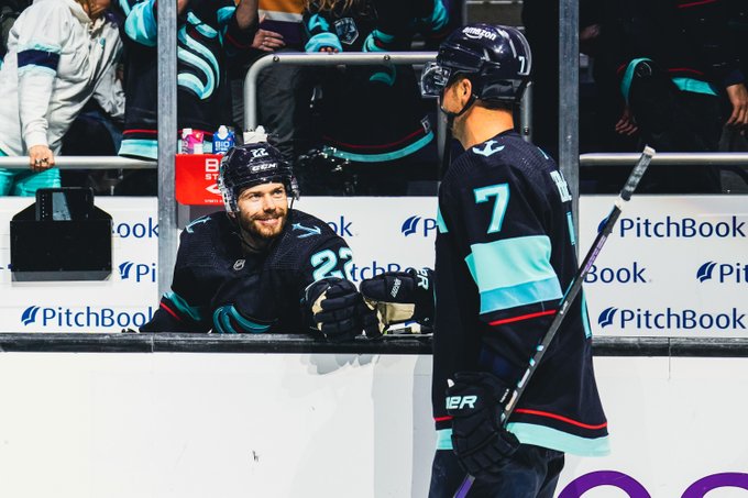 bjorky smiling and giving fist bump to ebs after the game