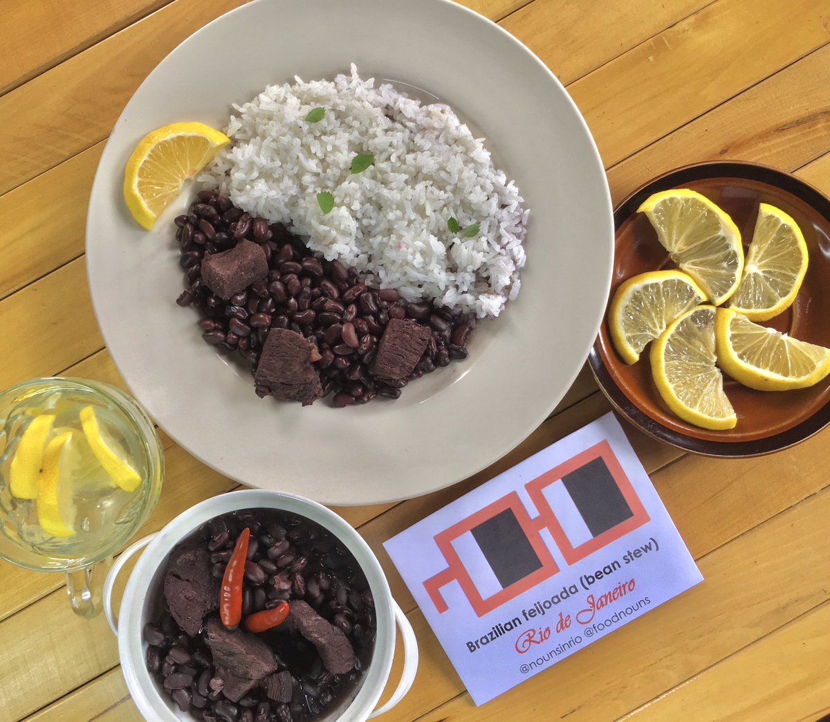 DixieBloom312's tweet photo. This is my version of black bean stew, which keeps the rich and smoky flavors that is common dish from Rio de Janeiro. Feijoada, or black bean stew, is made with black beans and salted pork and beef. White rice and lemon slices can be served as side dishes.@NounsInRio @foodnouns https://t.co/wm66rAmbMb