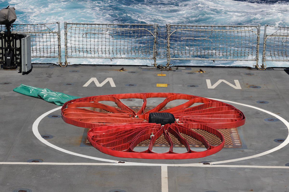 Our main #Remembrance Service was held at sea this year whilst we’re active on operations. Ship’s Company gathered on the flight deck to hear the reading of the roll of honour, and paused for a two-minute silence #LestWeForget #WeWillRememberThem