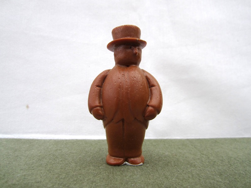 The_Jonateer's tweet photo. Starting with this stout gentleman - I don't know what he is. He's clearly the Fat Controller, but too tall to be the diecast Ertl, and too small to be the wind-up Ertl. The 'TEST' sticker underneath sheds no light. Open to suggestions. https://t.co/lLB2kxoeTy